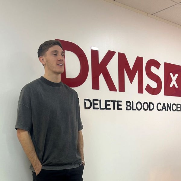 Jimmy Dunne at the DKMS UK office standing by the Corporate signage Jimmy Dunne at the DKMS UK office standing by the Corporate signage