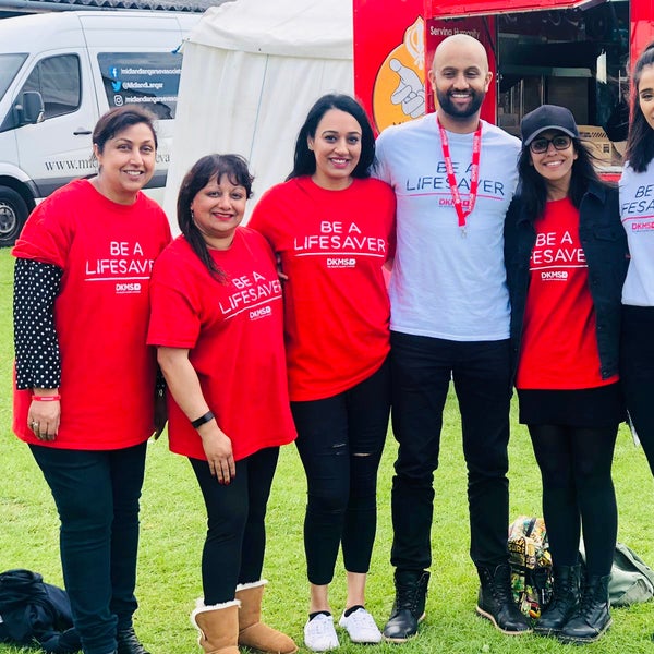DKMS volunteers wearing branded t-shirts DKMS volunteers wearing branded t-shirts