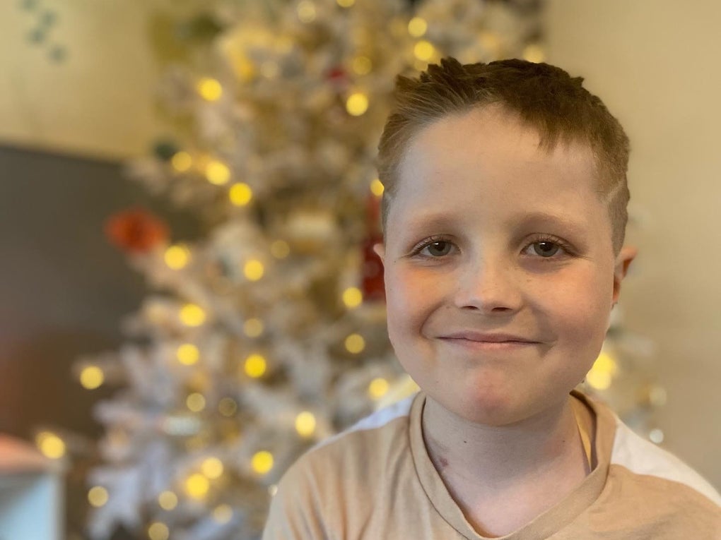 Rufus smiling in front of a Christmas Tree Rufus smiling in front of a Christmas Tree
