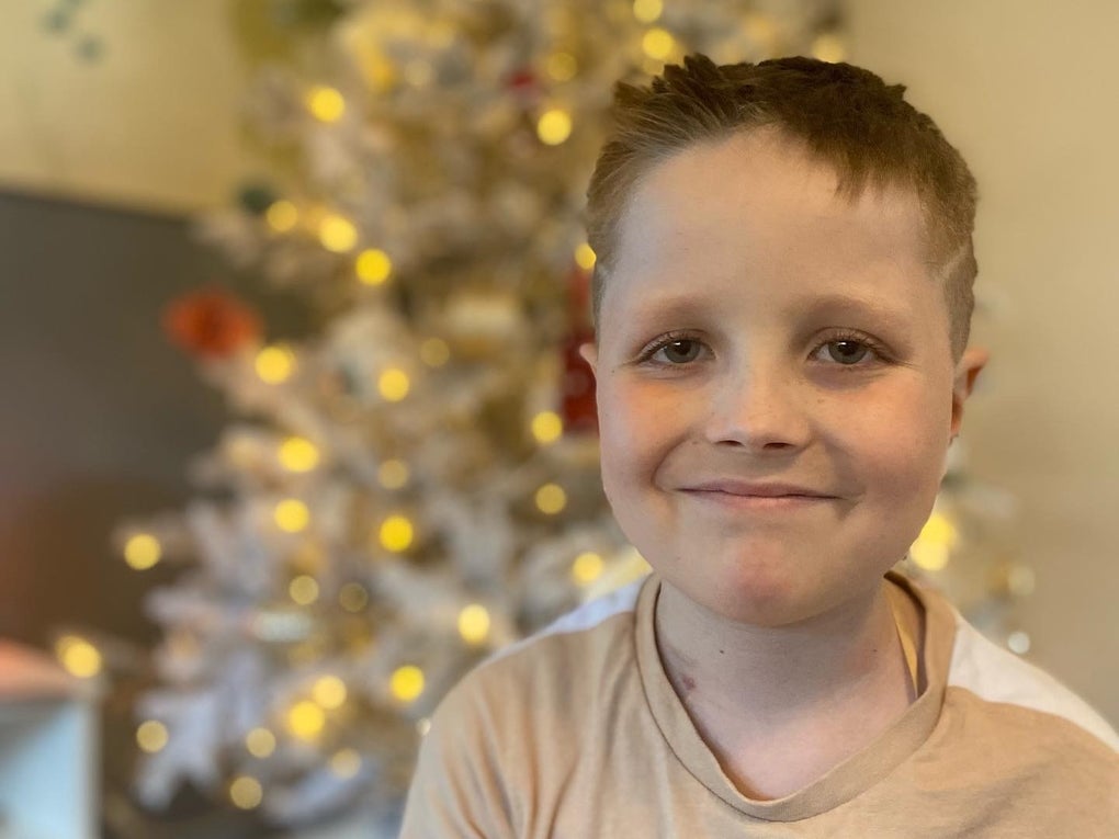 Rufus smiling in front of a Christmas Tree Rufus smiling in front of a Christmas Tree