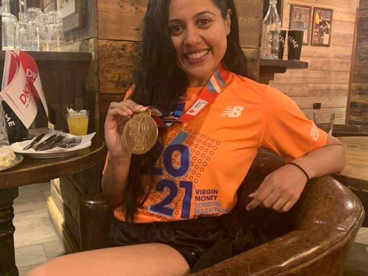 Priya Davdra wearing London Marathon medal