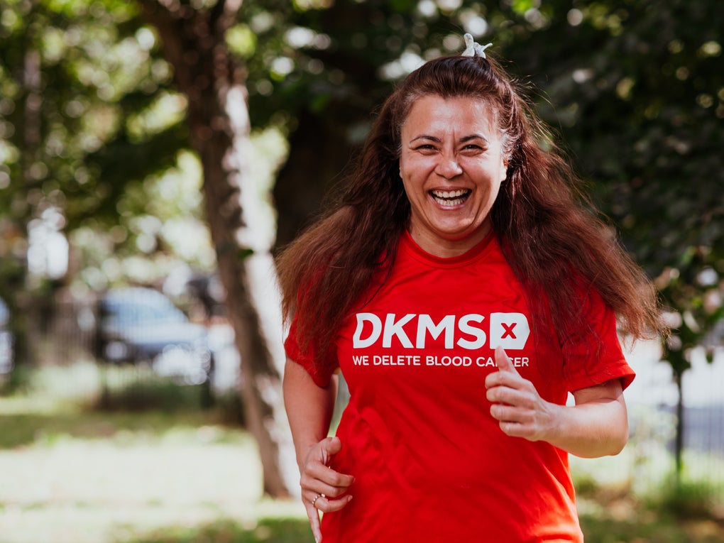 Woman running in her DKMS top Woman running in her DKMS top