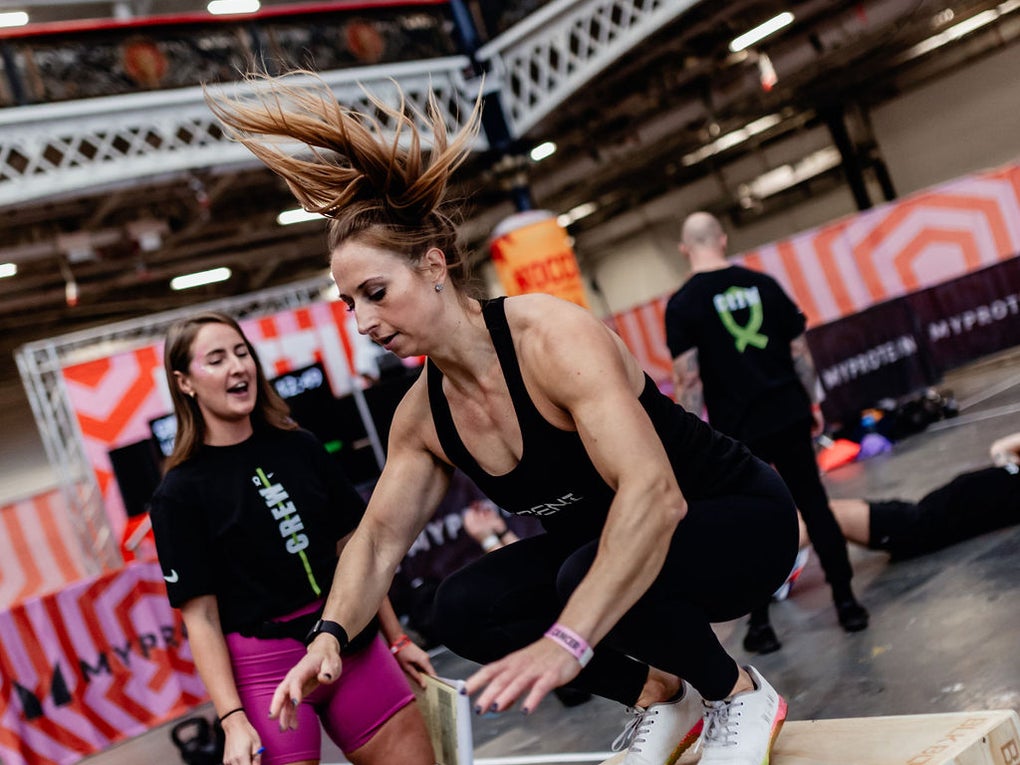 Woman jumping onto a box Woman jumping onto a box