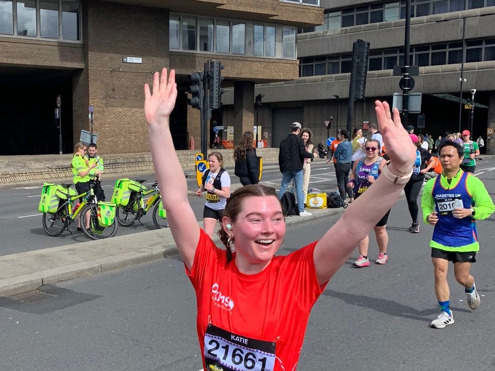 Katie in DKMS top cheering as she runs Katie in DKMS top cheering as she runs
