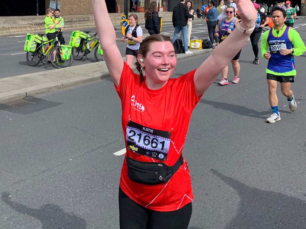 Katie in DKMS top cheering as she runs Katie in DKMS top cheering as she runs