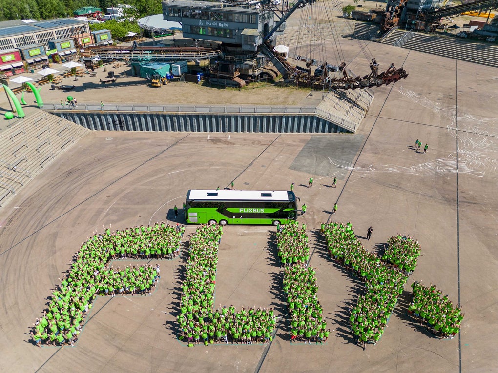 Flix employees in green spelling FLIX Flix employees in green spelling FLIX