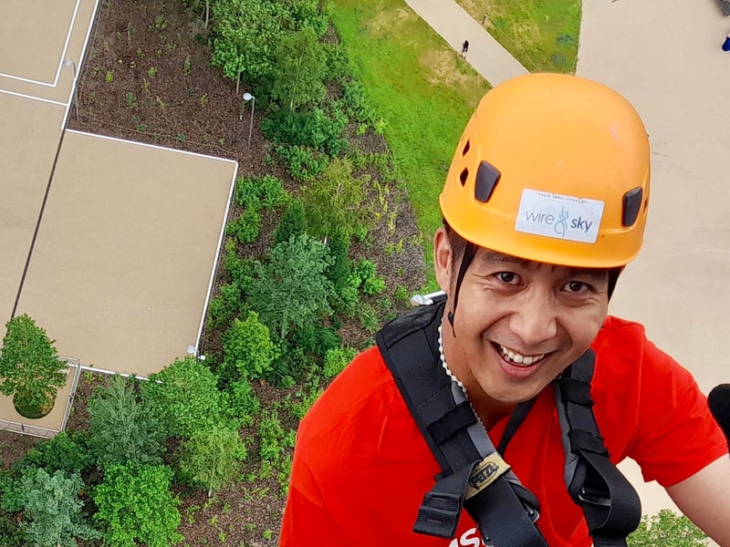 Ian Corpuz leading a fundraising abseiling event at the Olympic Park
