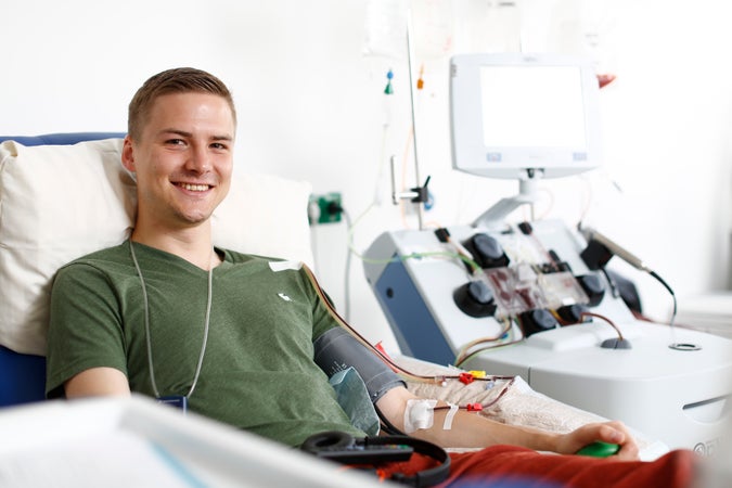 Man donating blood stem cells via peripheral blood stem cell collection