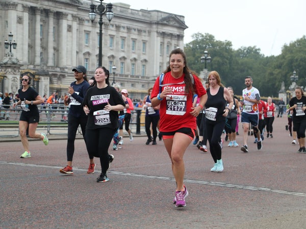 Lady in DKMS t-shirt running in London