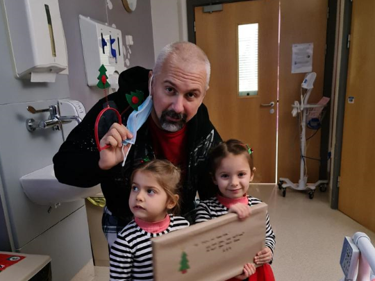 George with his twin daughters George with his twin daughters