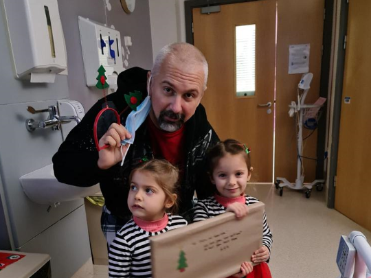 George with his twin daughters George with his twin daughters