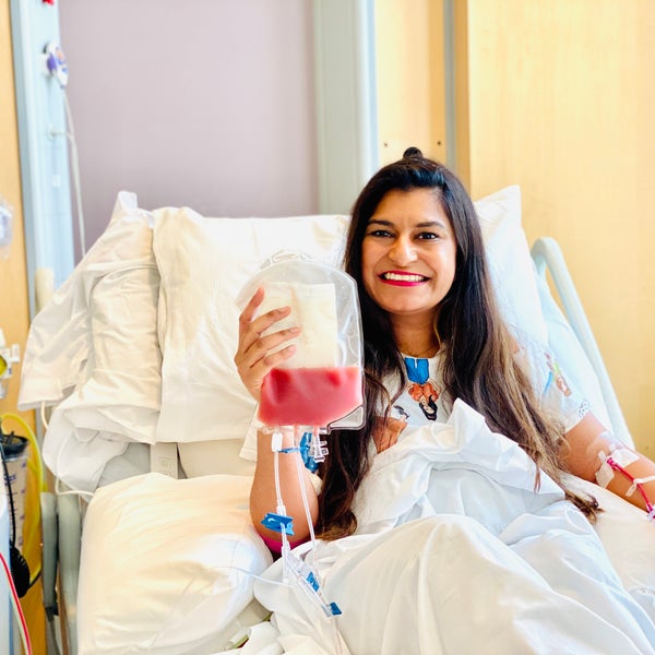 Asian lady holding a bag of blood Asian lady holding a bag of blood