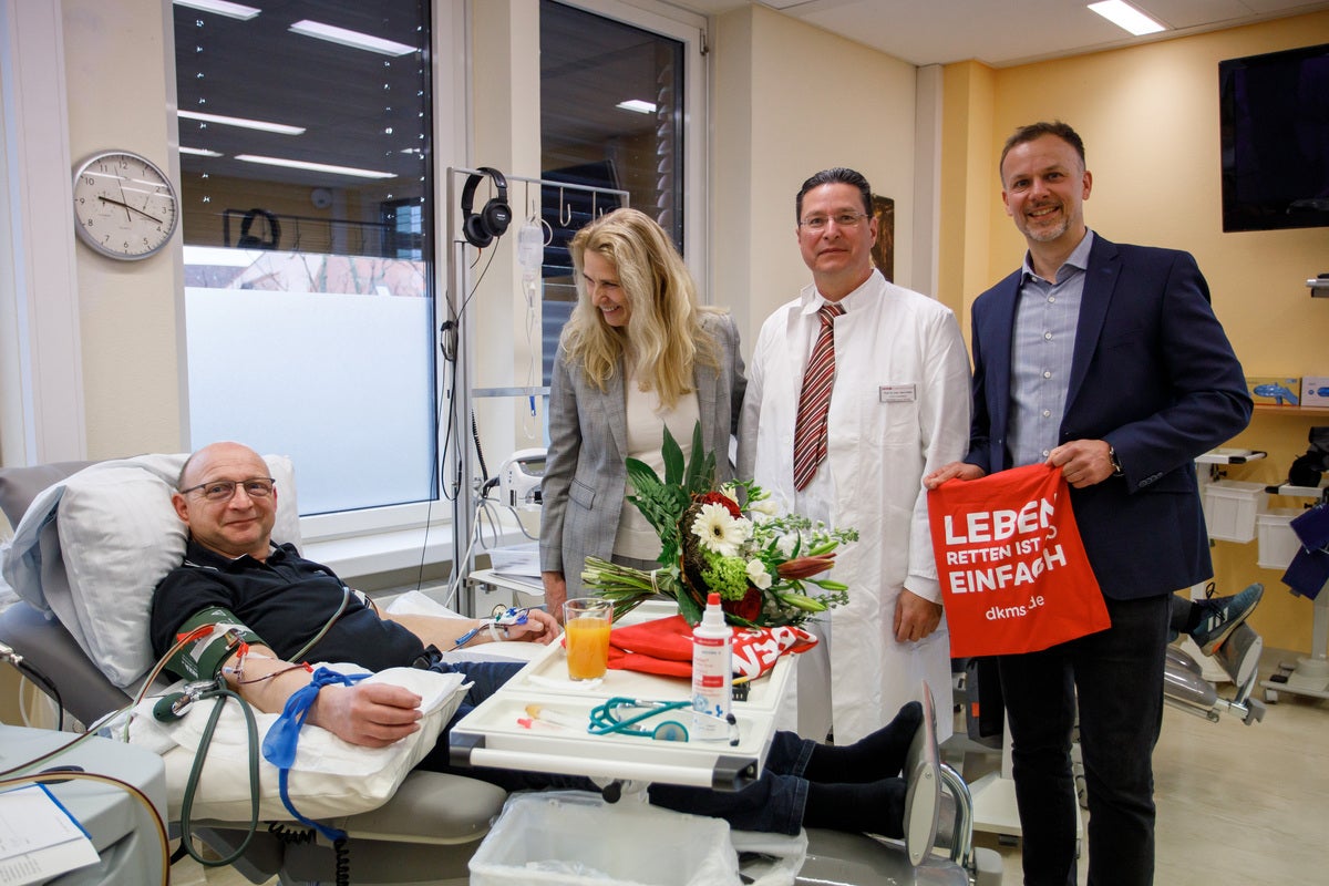 DKMS Chief Executive Officer Dr Elke Neujahr with donor and Dresden centre medical staff