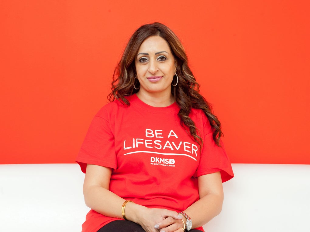 Person wearing a DKMS T-shirt sitting down Person wearing a DKMS T-shirt sitting down