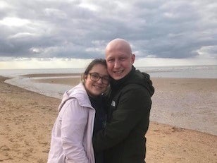 Ben and Amy smiling together on the beach Ben and Amy smiling together on the beach