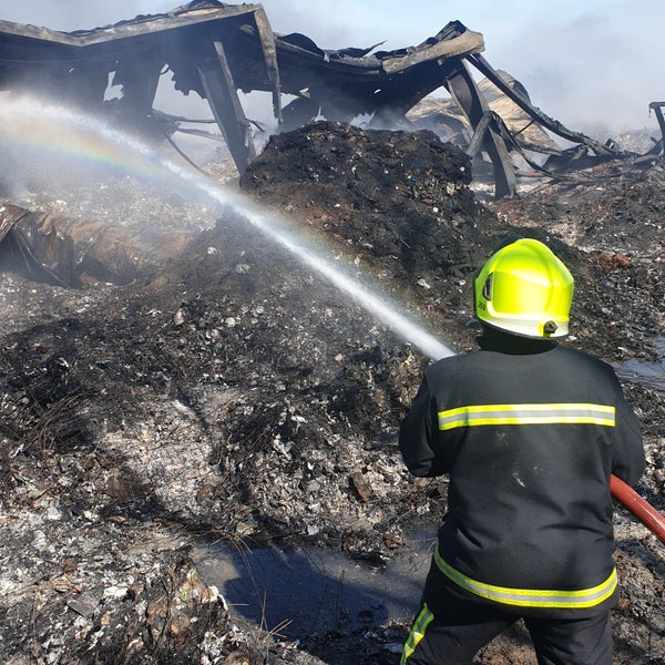 Firefighter putting out a fire Firefighter putting out a fire