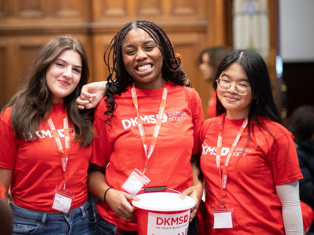 3 student ambassadors holding a DKMS collection bucket 3 student ambassadors holding a DKMS collection bucket