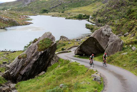 Two cyclists cycling the Ring of Kerry in County Kerry.
