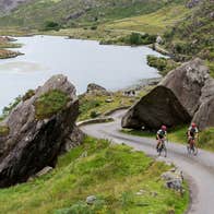 Two cyclists cycling the Ring of Kerry in County Kerry.