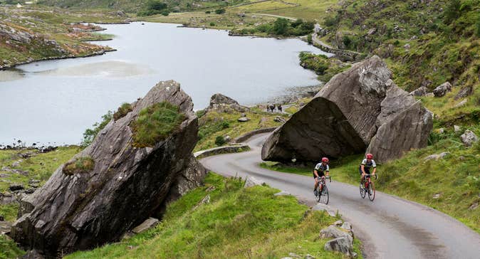Two cyclists cycling the Ring of Kerry in County Kerry.