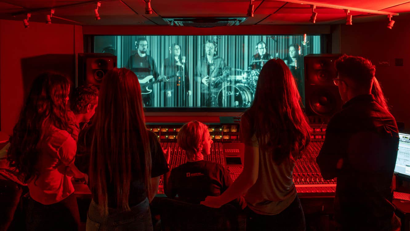 Group of visitors experiencing the Virtual Band in Studios