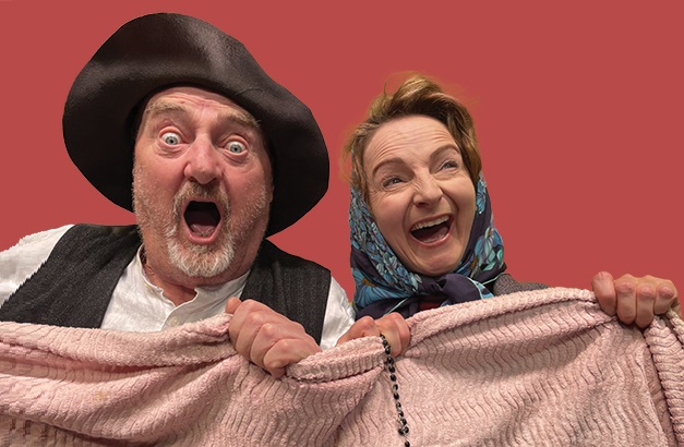 Photo with Jon on the left and Norma on the right, both dressed in old style clothes with surprised expressions on their faces