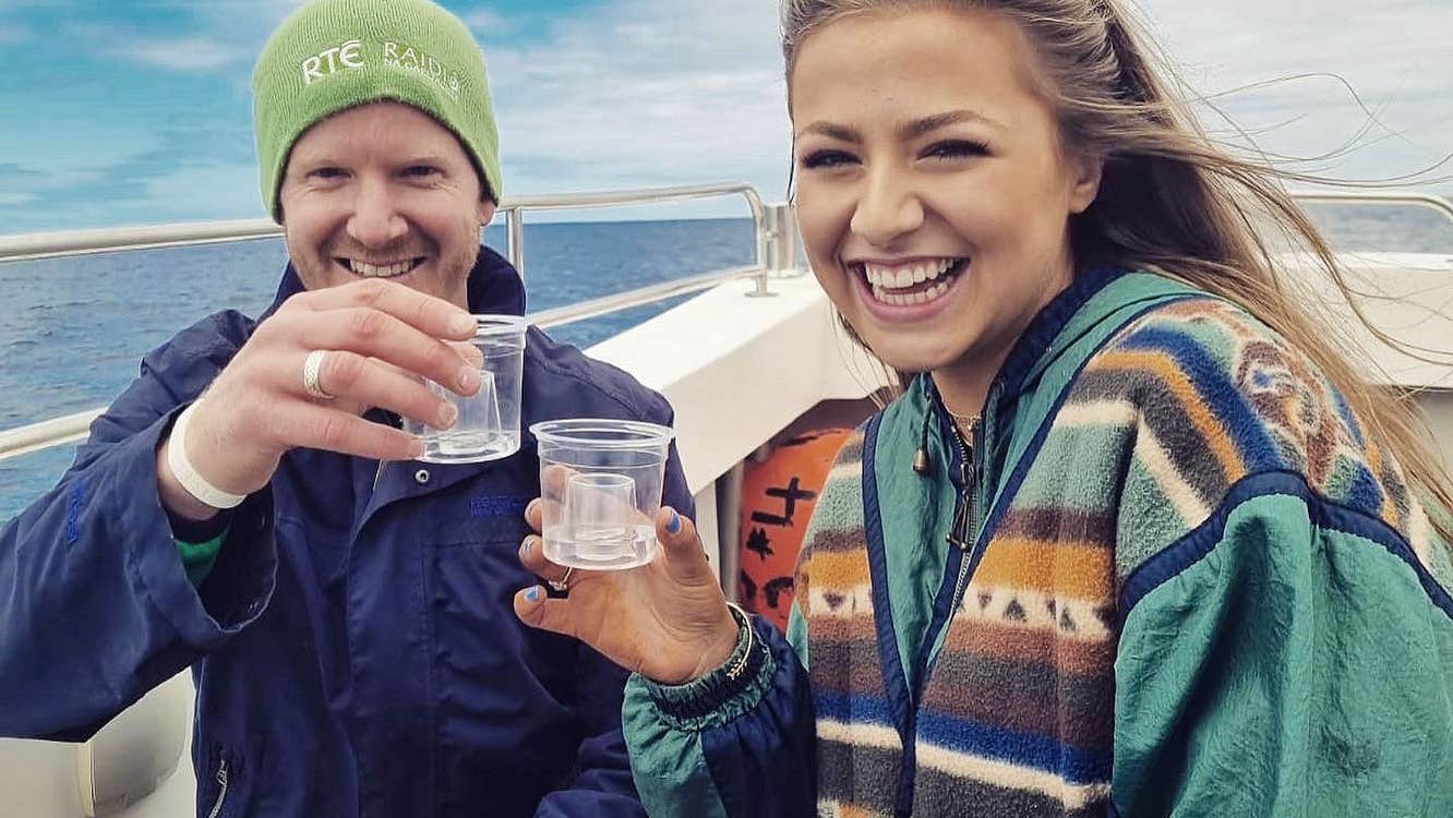 Couple enjoying a boat trip with Donegal Music Trails