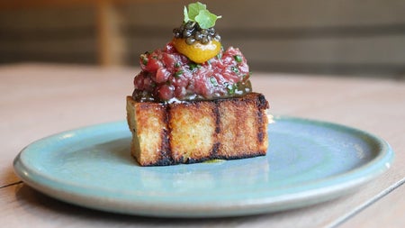 A caviar potato and sourdough chutney dish served at Bastible