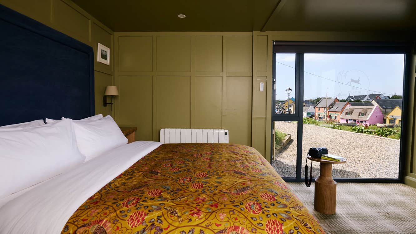 Double bed with white sheets