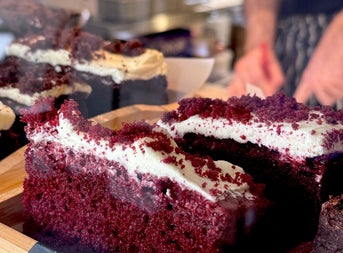 Close up image of two slices of red velvet cake