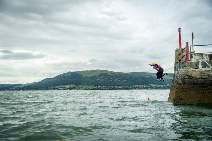 People jumping into the sea from Carlingford Pier in County Louth