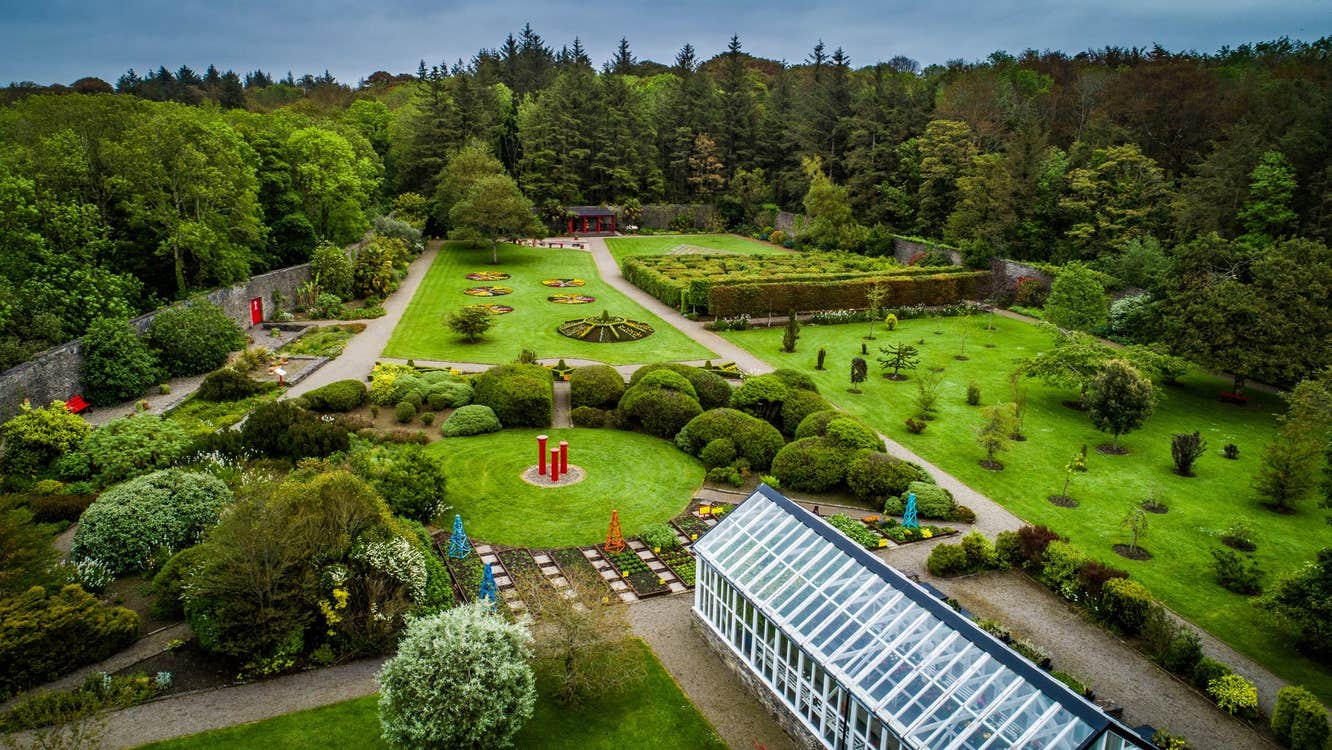 An aerial view across Vandeleur gardens with a glasshouse in the foreground