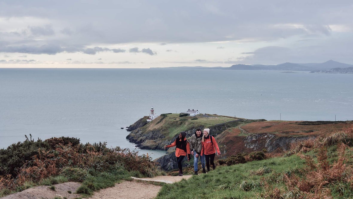 Group of people walking the Howth Cliff walk.