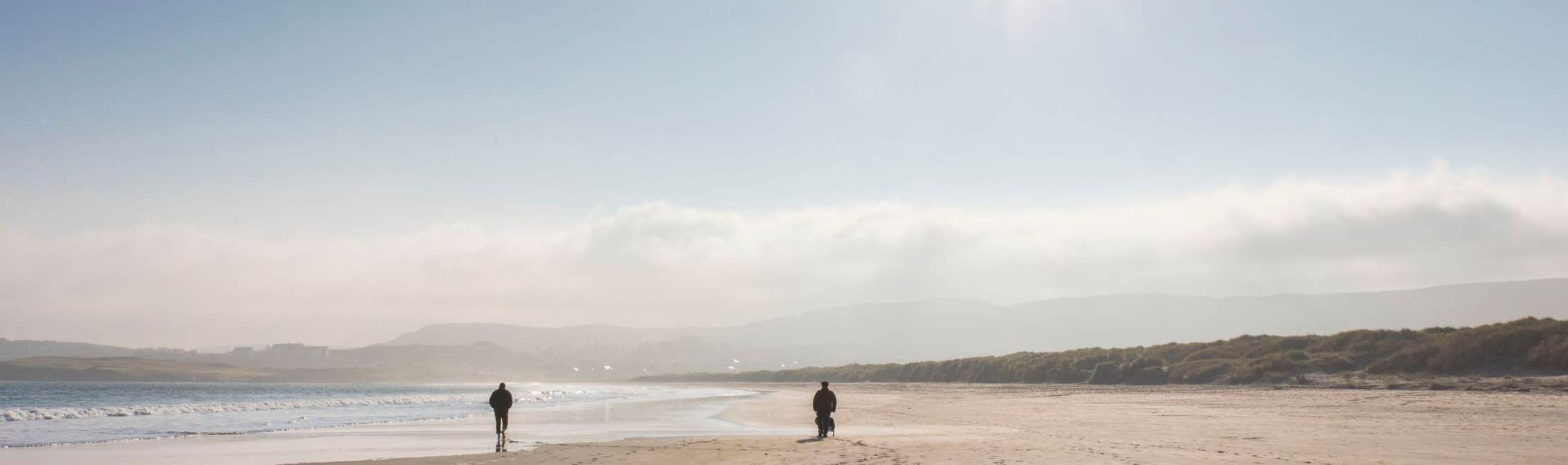 Image of walkers on the beach in Dunfanaghy in County Donegal