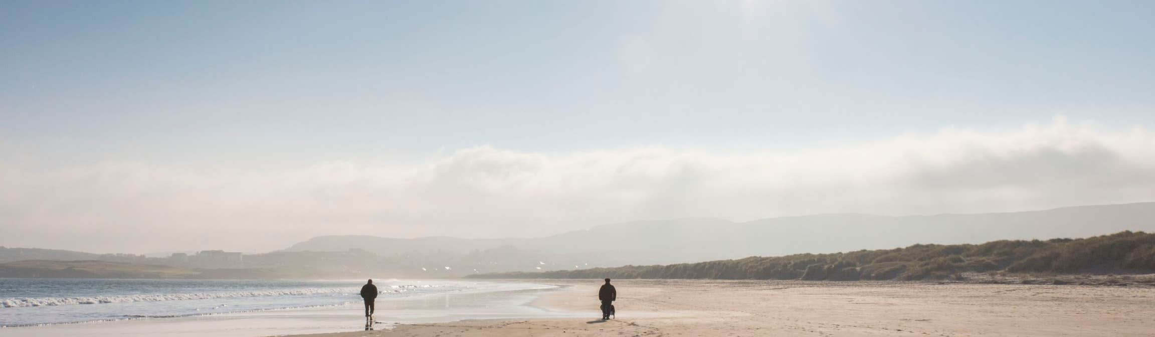 Image of walkers on the beach in Dunfanaghy in County Donegal