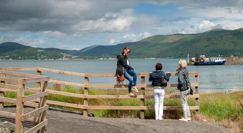 Three walkers enjoying the views from the Carlingford Greenway, County Louth