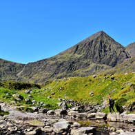 A hiker climbing Carrauntoohil in County Kerry
