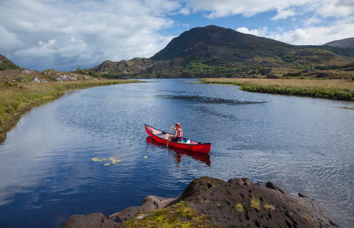 A person canoeing the lakes of Killarney in County Kerry.