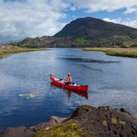 A person canoeing the lakes of Killarney in County Kerry.