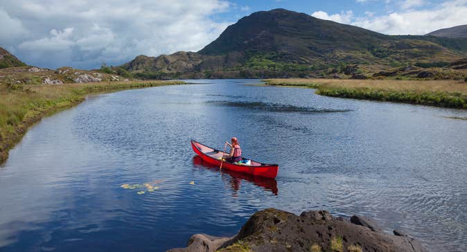 A person canoeing the lakes of Killarney in County Kerry.