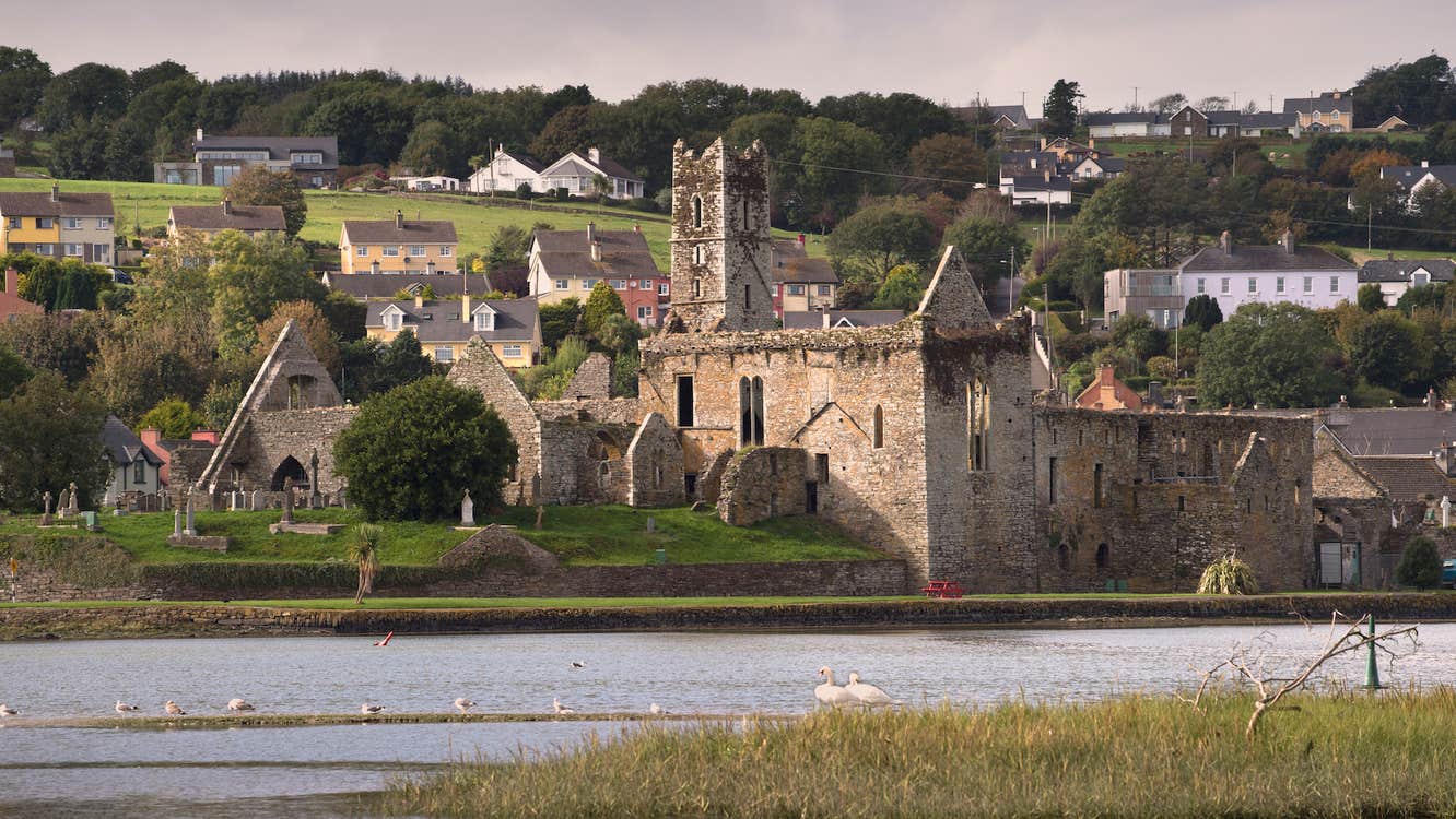 Distant image of Timoleague Abbey and the River Arigideen in County Cork.