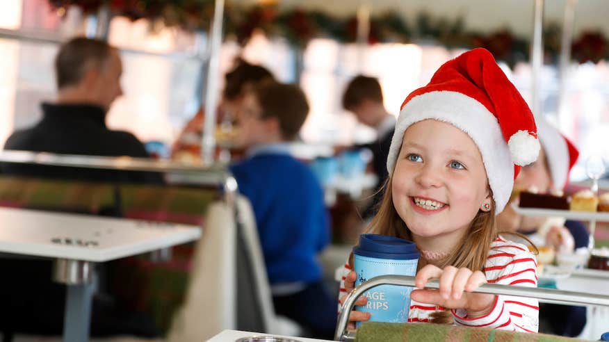 A child wearing a Santa hat on a Vintage Tea Trips tour in Dublin city
