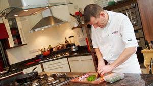 A chef preparing food at Just Cooking in Kerry