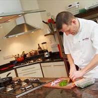 A chef preparing food at Just Cooking in Kerry