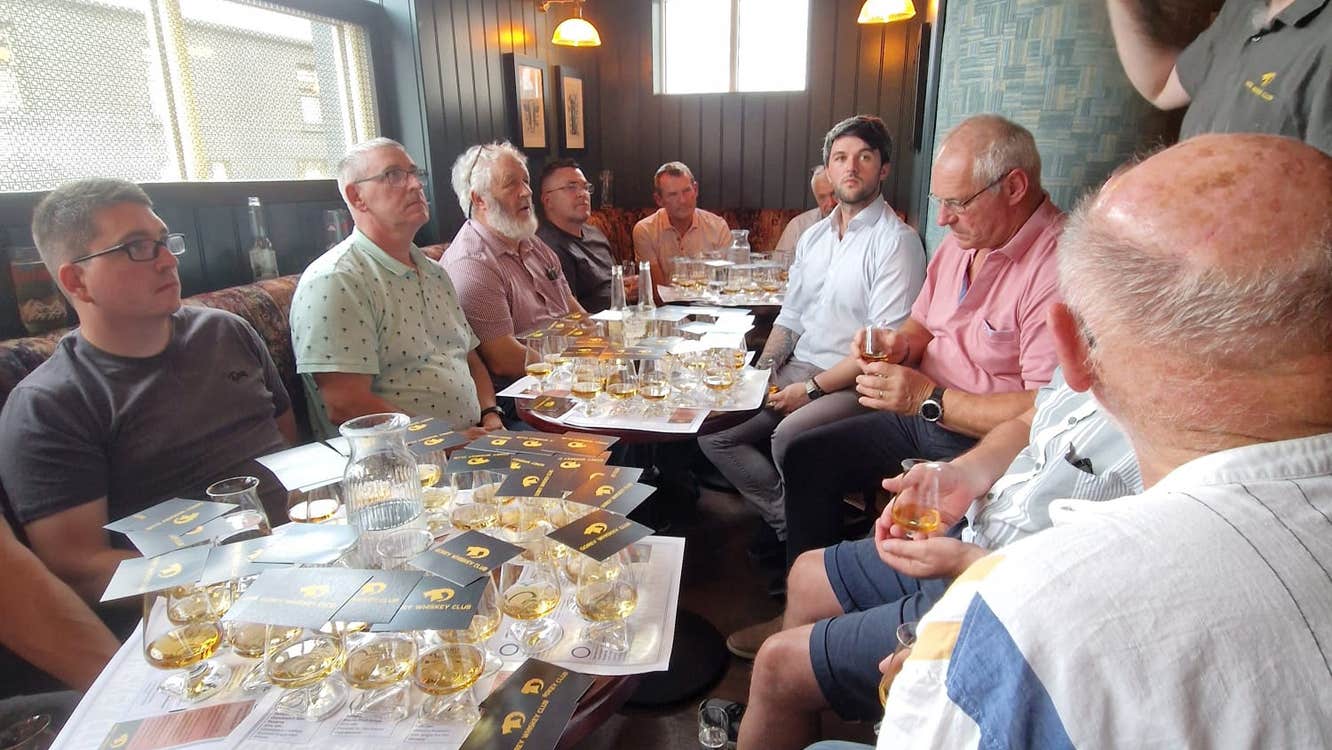 A guided tasting in full flow at a Gorey Whiskey Club night. The festival brings eight ticketed sessions like this one to four venues across Gorey on 6 and 7 November 2026.