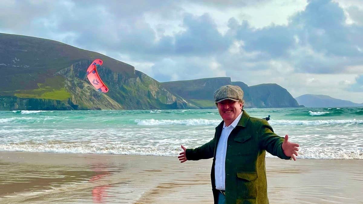Jack Ward from Racontour - Cultural Tours of Ireland standing on a beach
