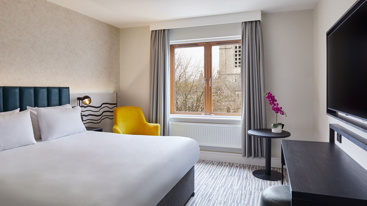 Double bed with white sheets