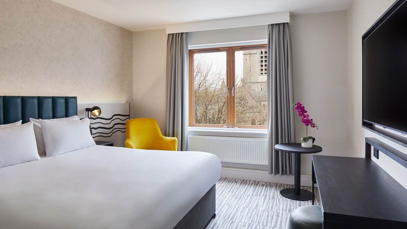 Double bed with white sheets