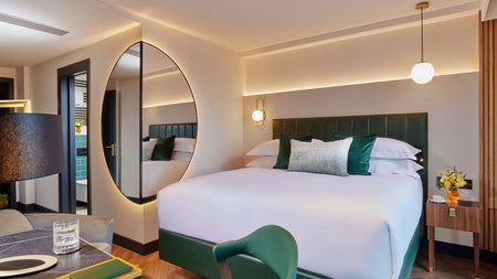 Double bed with white sheets