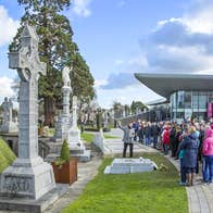 A group enjoying a guided tour of Glasnevin Cemetery